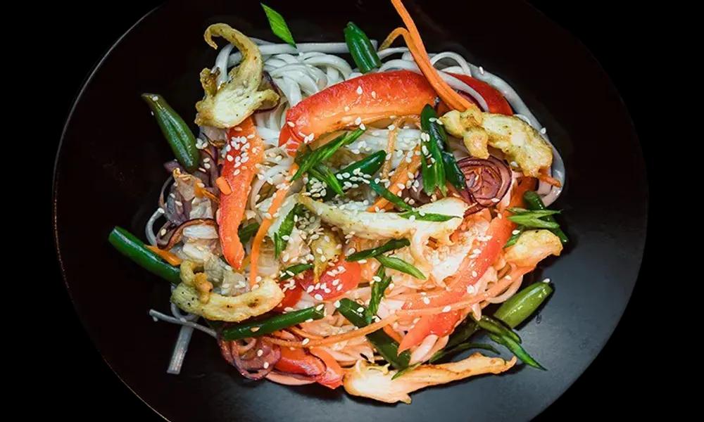 WOK noodles with chicken in sweet and sour sauce