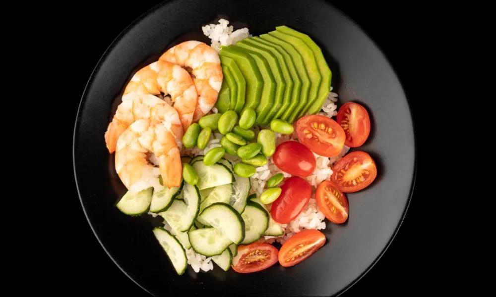 Bowl with rice, shrimp and nut sauce