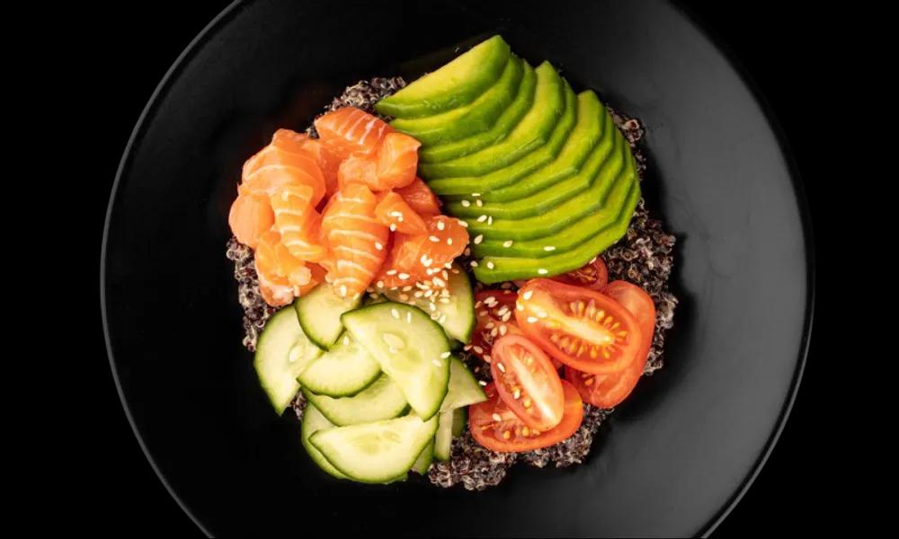 Bowl with quinoa, salmon, vegetables and honey mustard sauce